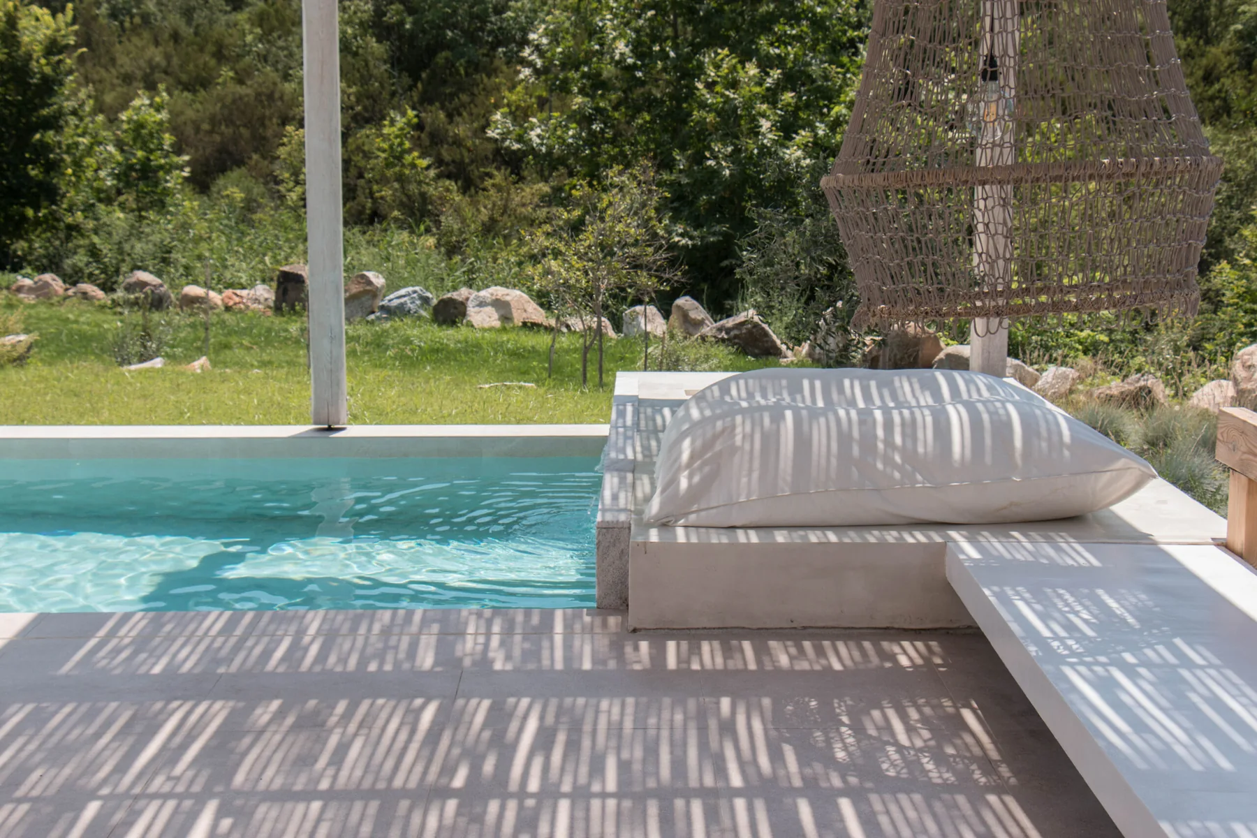 Poolside view surrounded by greenery